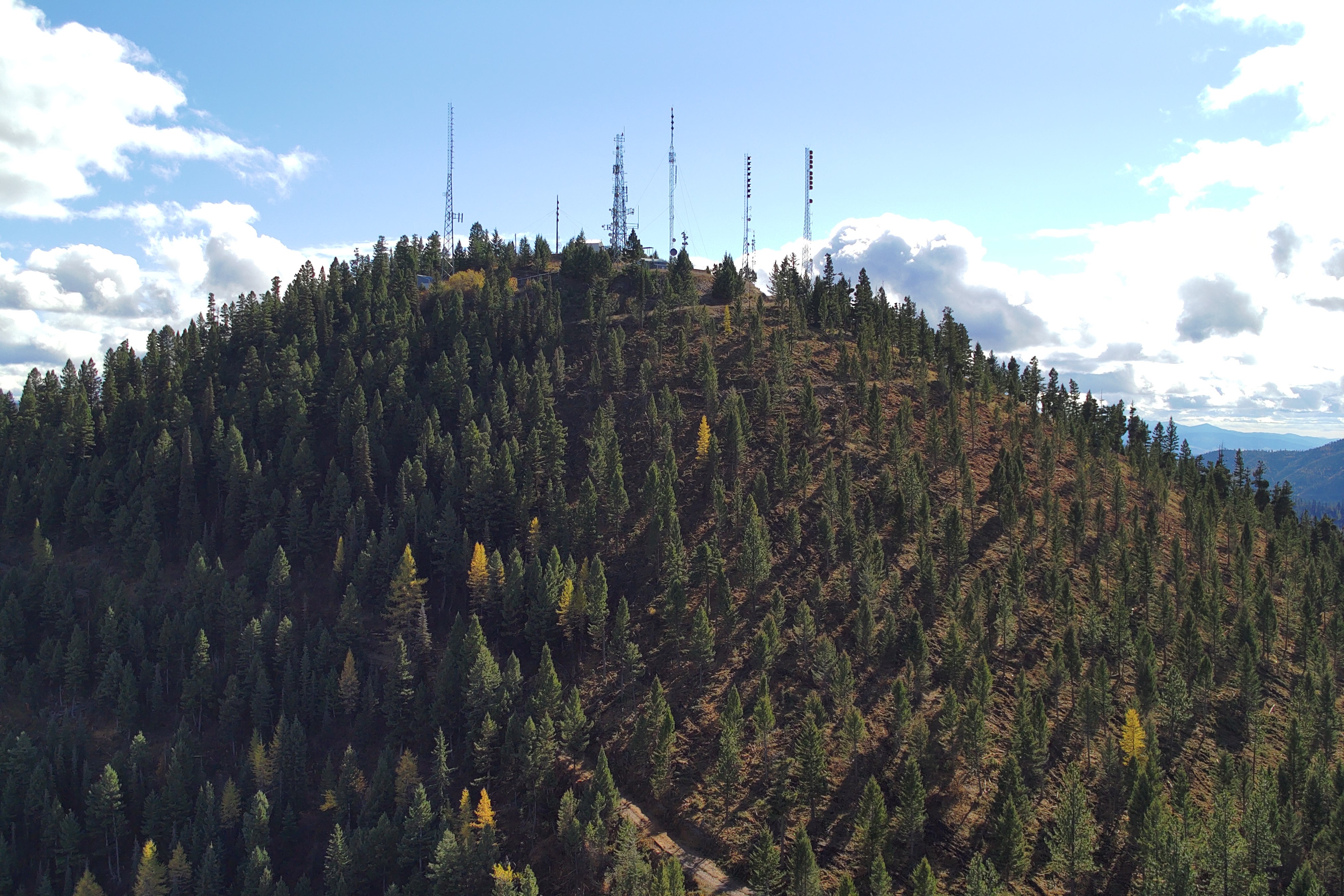 Radio and phone towers on top of a mountain