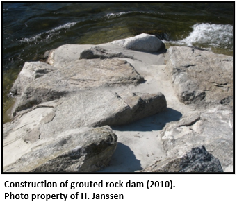 Photo of construction of grouted rock dam