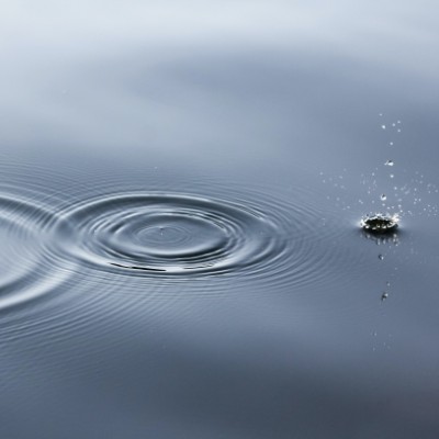a drop of water with ripples